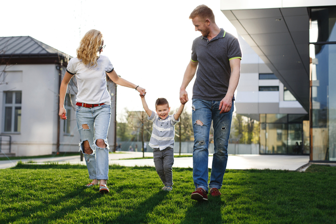 mom-dad-whirl-their-son-have-fun-walking-outside